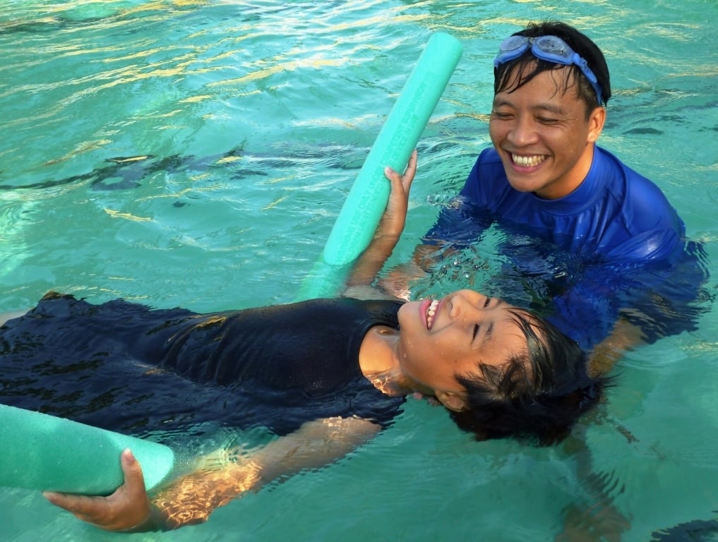Students developing swimming technique during a professionally delivered water safety lesson