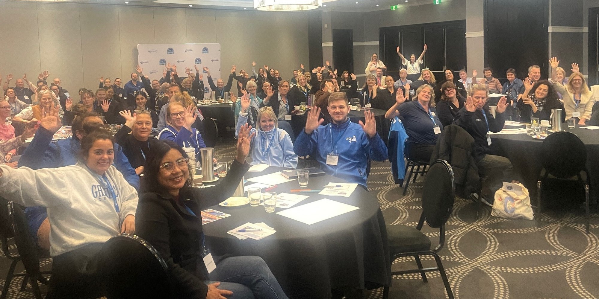 Participants attending the AUSTSWIM safeguarding professional development launch event focused on child safety in aquatic education.