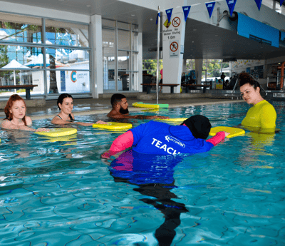 AUSTSWIM teacher in training in a swimming pool
